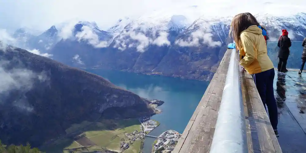 Looking down the platform rail to the village at the head of the fjord