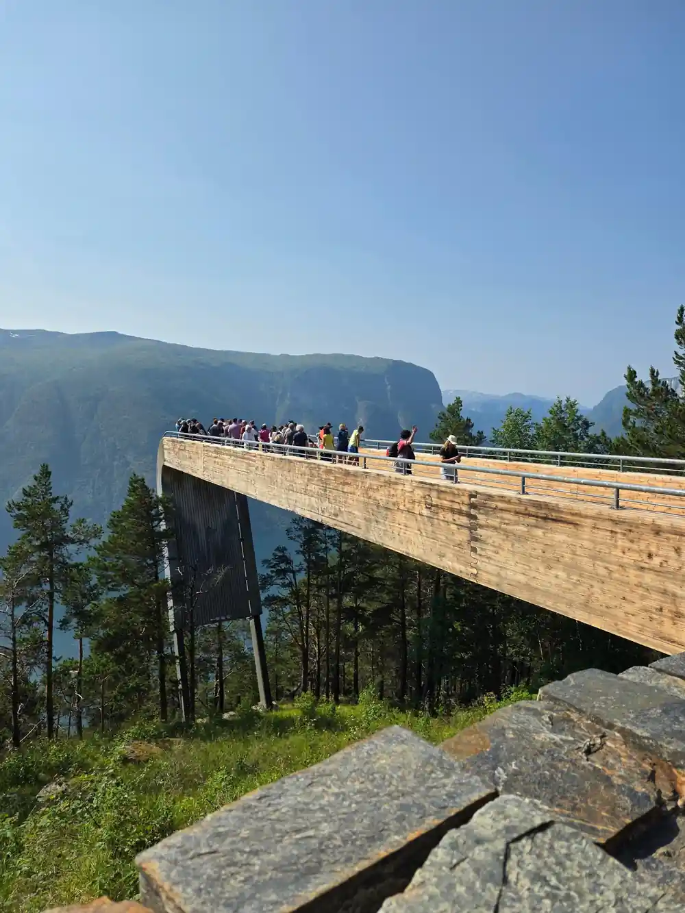 The Stegastein platform seen side-on with visitors along its length