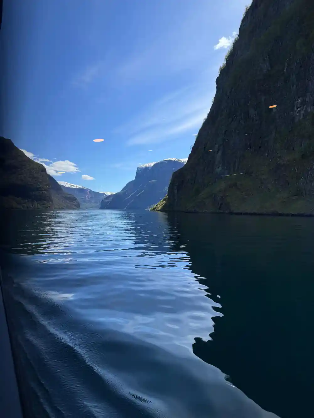 The wake running back down the narrow arm between high walls